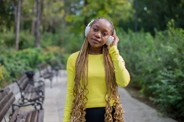 Medium box braids with curly ends are a variation of the traditional box braids